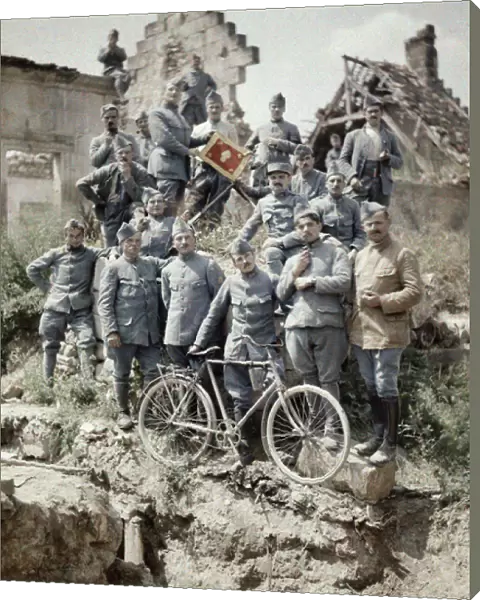 French officers of the 370th Infantry Regiment posing in the ruins after the attack of