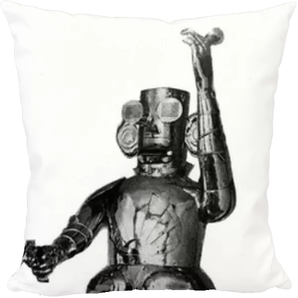 The advertising robot, which rises to its feet, fires a gun to get attention, and then announces the goods it is advertising (b  /  w photo)