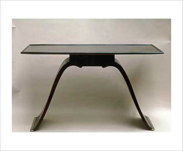 Macassin ebony table, with brass-bound feet, by Emile Jacques Ruhlmann, c. 1930-32