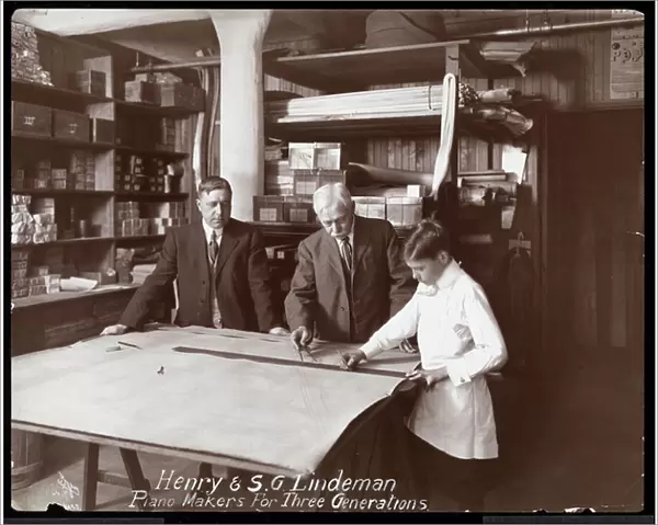Portrait of Henry and S. G. Lindeman with their son or grandson standing over shop