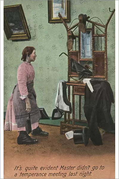 Maid clearing up a mans clothes (colour photo)