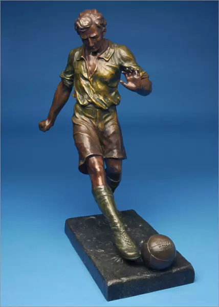 Figure kicking a ball (cold painted spelter)