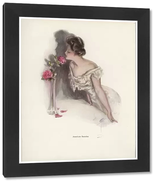 American woman smelling pink roses in a vase (colour litho)