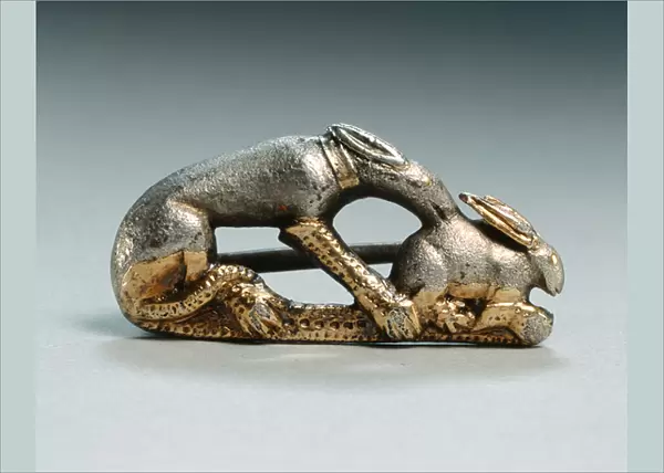 Fibula of a dog catching a rabbit (silver & gilt)