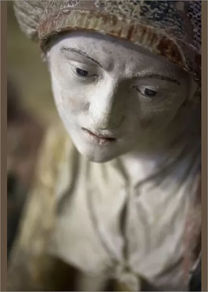 Holy woman in a bonnet (painted stone)