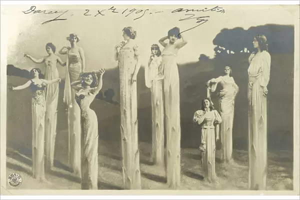 Women on stilts dressed as asparagus (b  /  w photo)