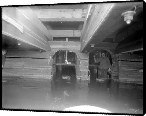 Worker inside the W. 129th Street sewer, New York, c. 1911 (b  /  w photo)