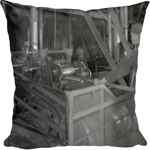 Worker feeding lumber into a planer, Oneida, New York, April 3, 1916 (b  /  w photo)
