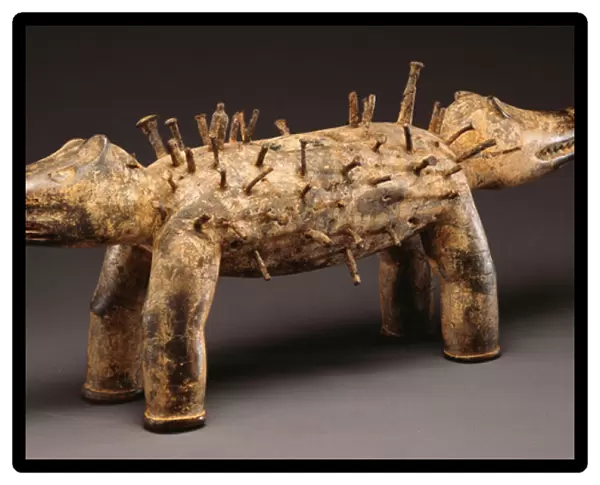 A Kongo power dog figure (wood, nails)