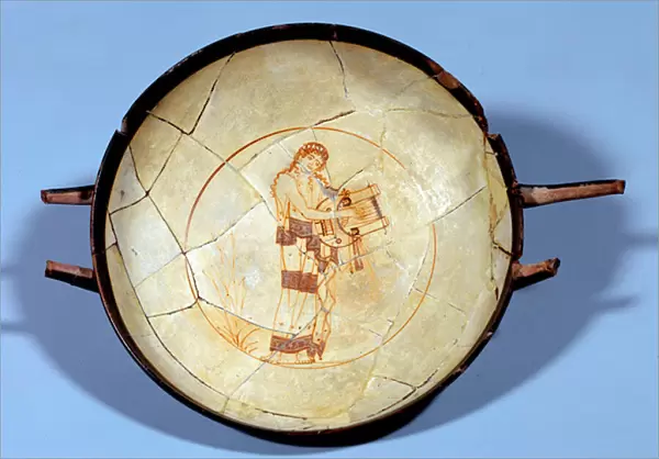 Greek art: cup with white background in ceramic decoree of a muse playing the cithar
