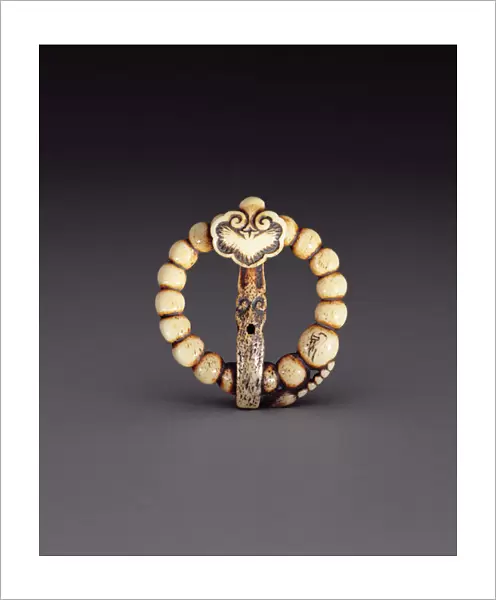 Netsuke in the form of a rosary with a stylised wishing wand, c. 1870 (stag-antler)