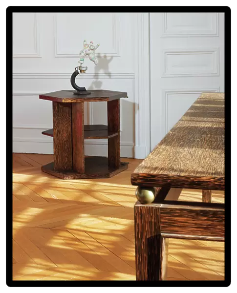 Articulated library table (Palmwood veneered wood and oxidized brass)