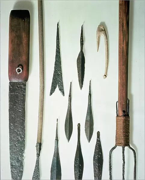 An assortment of tools and spearheads (wood and metal)