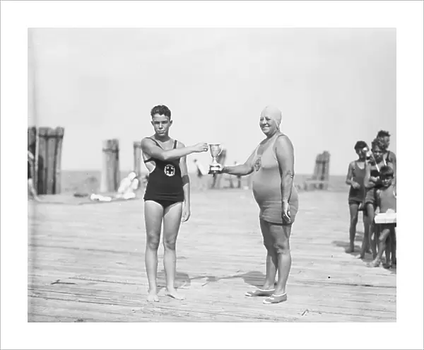 Two Swimmers Holding Trophy, 1927 (b / w photo)
