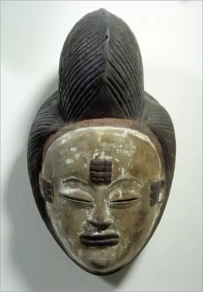 African Art: Mukuyi mask from Gabon made of wood and kaolin powder. Dim. 28 cm Paris, Musee Picasso