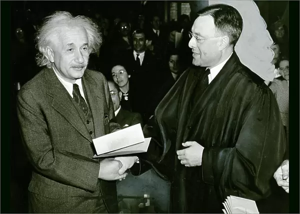Albert Einstein receiving from judge Phillip Foreman, his certificate of American citizenship, 1940 (b / w photo)