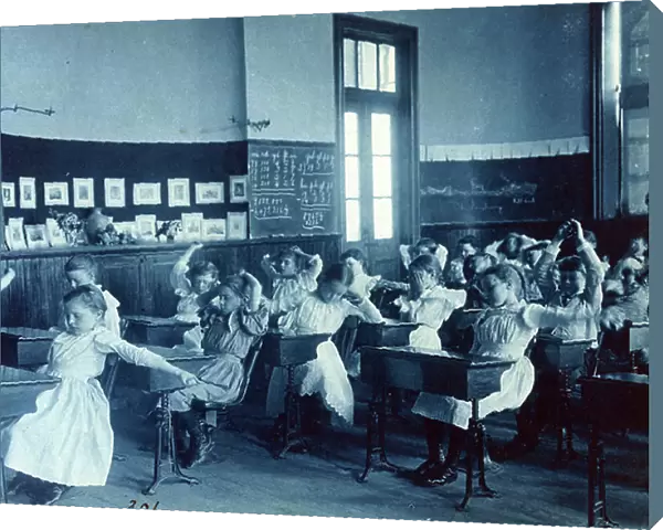 Photographic print, Cyanotype : Children doing calisthenics while sitting at their desks in a classroom, 5th Division public schools, Washington, D. C