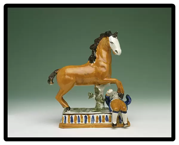 Figurine of a horse trampling a man, from Staffordshire (ceramic)