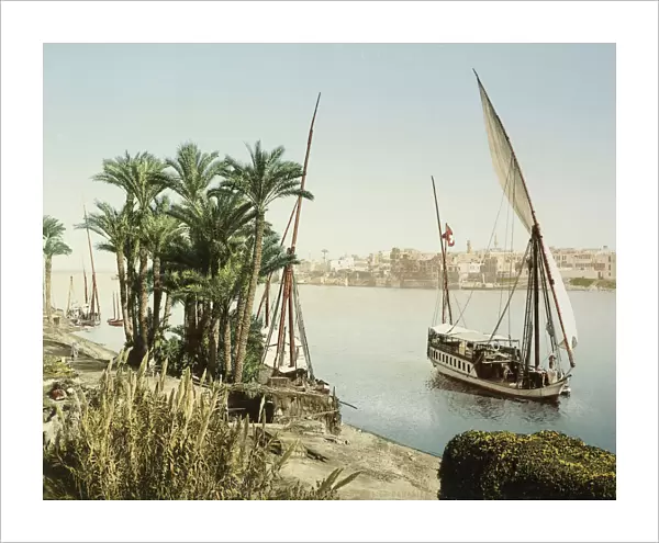 Sailing boats bank Nile looking across Cairo