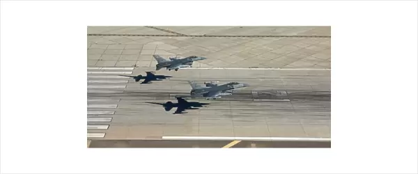 Two F-16s land in formation at Luke Air Force Base, Arizona