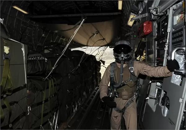 Container Delivery System bundles exit a C-17 Globemaster during an airdrop mission