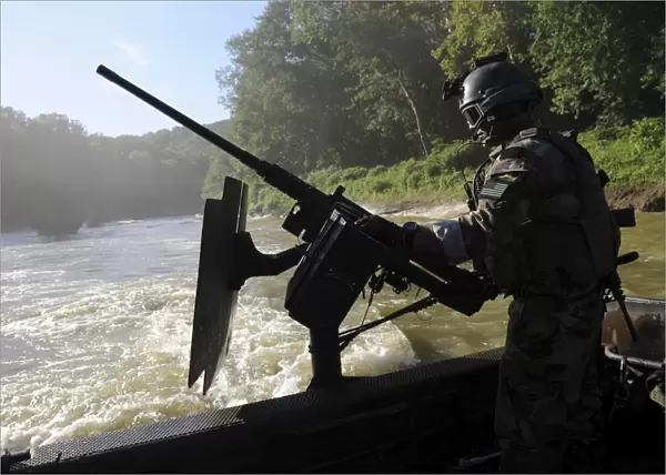 A Special Warfare Combatant-craft Crewman manning an M240N