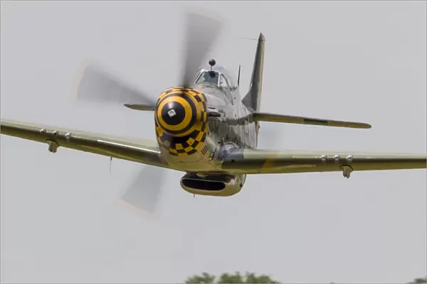 A P-51 Mustang flies by at East Troy, Wisconsin