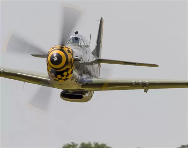 A P-51 Mustang flies by at East Troy, Wisconsin