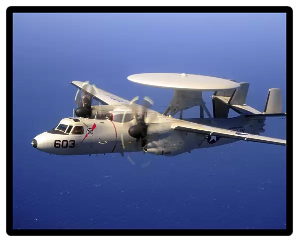 An E-2C Hawkeye flying over the Pacific Ocean