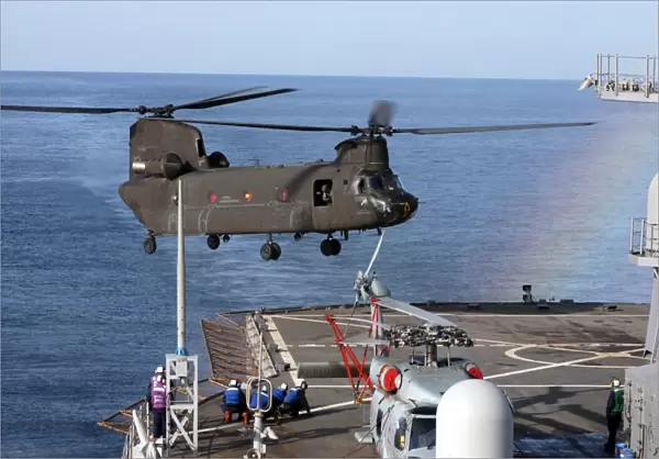An Army CH-47 Chinook pulls in for a landing aboard USS Blue Ridge