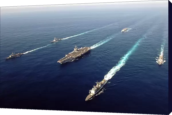 The Enterprise Carrier Strike group sails through the Atlantic Ocean in formation