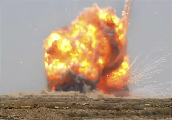 A controlled detonation is set off to destroy unexploded ordnance outside Bassami, Iraq