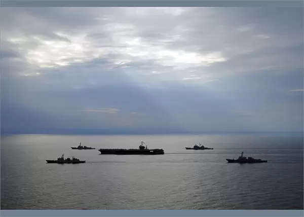 A fleet of multinational Navy ships transit the Korea Strait