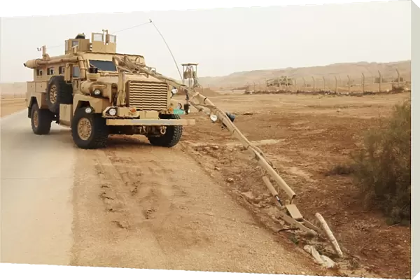 A MRAP vehicle disassembles an improvised explosive device