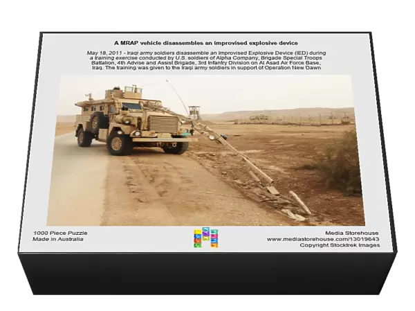 A MRAP vehicle disassembles an improvised explosive device