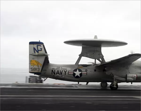 An E-2C Hawkeye launches from the flight deck of USS John C. Stennis