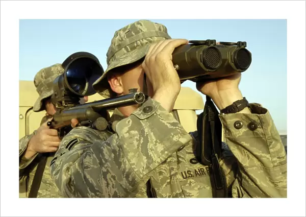 Soldiers demonstrate a buddy sniper position