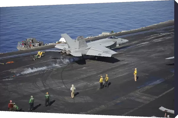 An F  /  A-18E Super Hornet launches from USS Nimitz