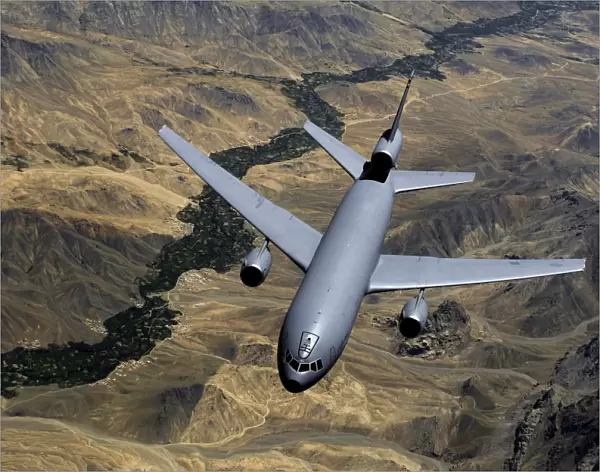 A KC-10 Extender aircraft moves out of position after receiving fuel