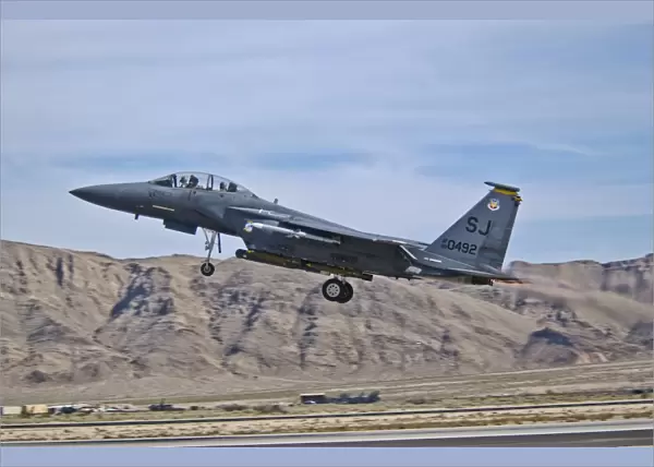 A U. S. Air Force F-15E Strike Eagle taking off from Nellis Air Force Base