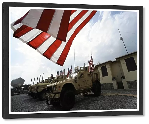 American flags are displayed on tactical vehicles in remembrance of 9  /  11