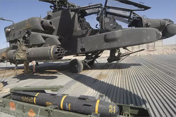 An AGM-114 Hellfire missile is ready to be loaded onto an AH-64 Apache