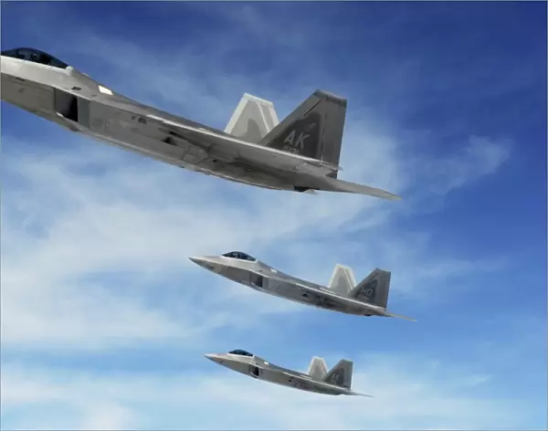 A three-ship formation of F-22 Raptors