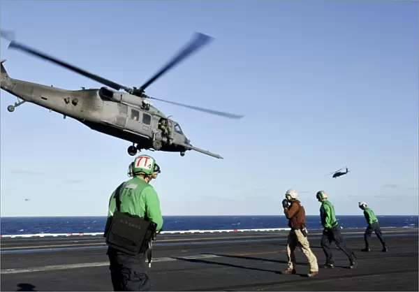 A U. S. Air Force HH-60G Pave Hawk helicopter lifts off from USS Nimitz