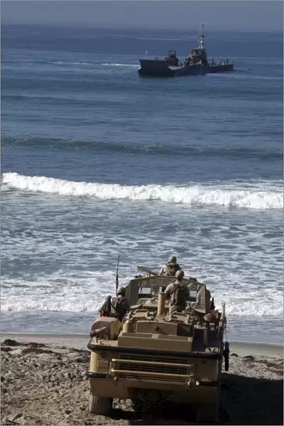 Marines anticipate the arrival of an Improved Navy Lighterage System