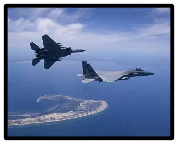 Two F-15 Eagles fly high over Cape Cod, Massachusetts