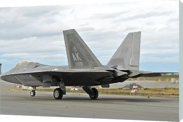 An F-22 Raptor taxis the runway on Elmendorf Air Force Base, Alaska