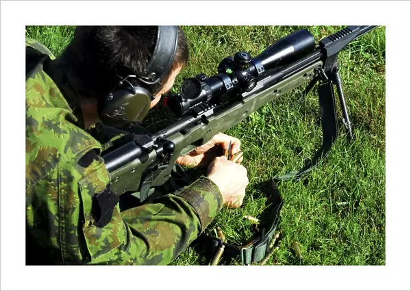 A Lithuanian special operations soldier engages targets with an assault rifle