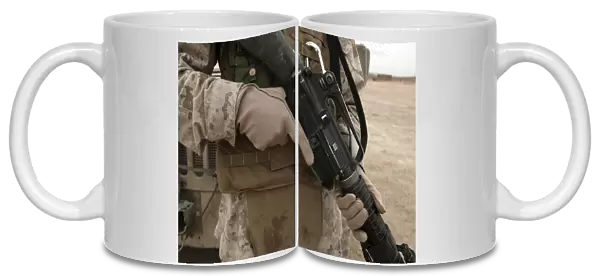 A Marine displays the required hand personal protective equipment
