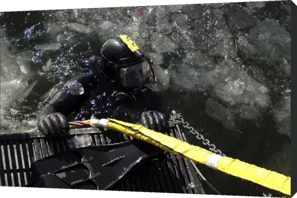U. S. Navy Diver gets ready to start his dive off the back of a dive training boat